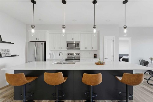 211-4150 Seton Drive Se, Calgary, AB - Indoor Photo Showing Kitchen With Double Sink With Upgraded Kitchen