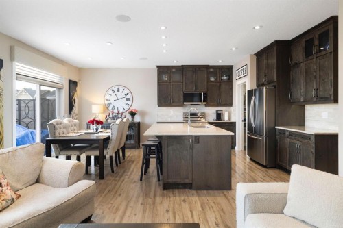 8 Emberside Glen, Cochrane, AB - Indoor Photo Showing Kitchen With Stainless Steel Kitchen With Upgraded Kitchen