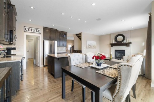 8 Emberside Glen, Cochrane, AB - Indoor With Fireplace