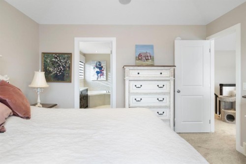 8 Emberside Glen, Cochrane, AB - Indoor Photo Showing Bedroom