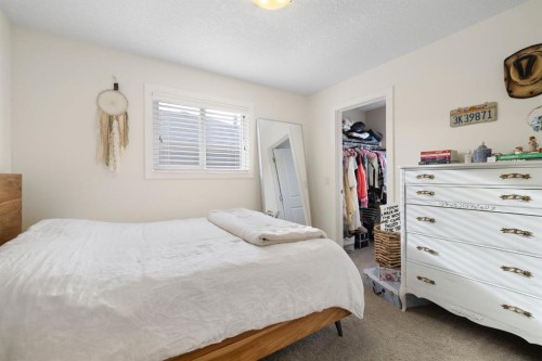 8 Emberside Glen, Cochrane, AB - Indoor Photo Showing Bedroom