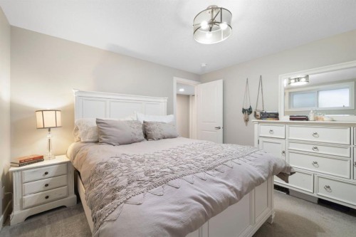 8 Emberside Glen, Cochrane, AB - Indoor Photo Showing Bedroom