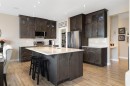 8 Emberside Glen, Cochrane, AB  - Indoor Photo Showing Kitchen With Stainless Steel Kitchen With Upgraded Kitchen 