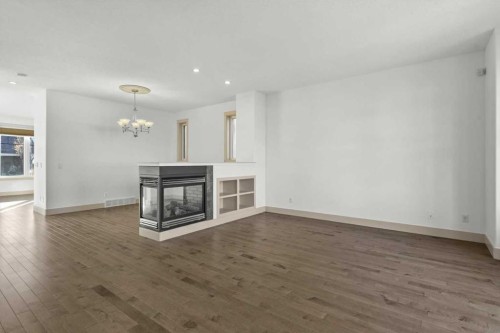 433 19 Avenue Ne, Calgary, AB - Indoor Photo Showing Living Room With Fireplace