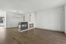 433 19 Avenue Ne, Calgary, AB  - Indoor Photo Showing Living Room With Fireplace 