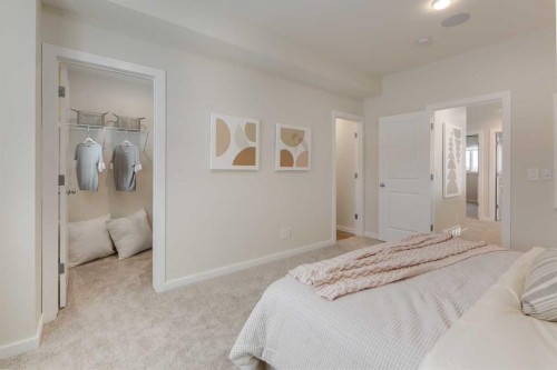 62 Starling Boulevard Nw, Calgary, AB - Indoor Photo Showing Bedroom