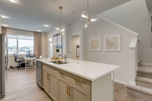 62 Starling Boulevard Nw, Calgary, AB - Indoor Photo Showing Kitchen With Double Sink