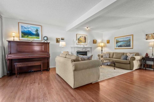 63 Springbank Crescent Sw, Calgary, AB - Indoor Photo Showing Living Room With Fireplace