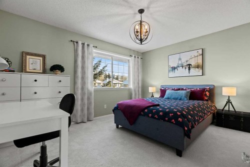 63 Springbank Crescent Sw, Calgary, AB - Indoor Photo Showing Bedroom