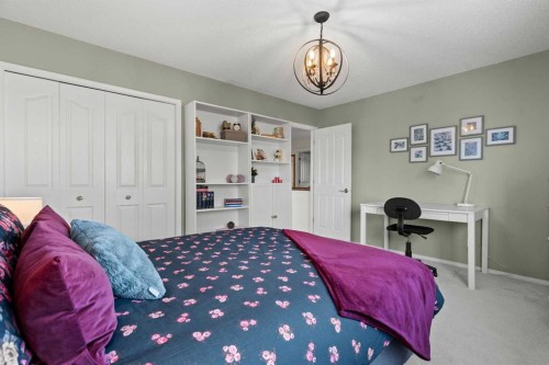 63 Springbank Crescent Sw, Calgary, AB - Indoor Photo Showing Bedroom