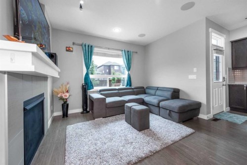80 Legacy Reach Manor Se, Calgary, AB - Indoor Photo Showing Living Room With Fireplace