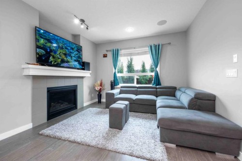 80 Legacy Reach Manor Se, Calgary, AB - Indoor Photo Showing Living Room With Fireplace