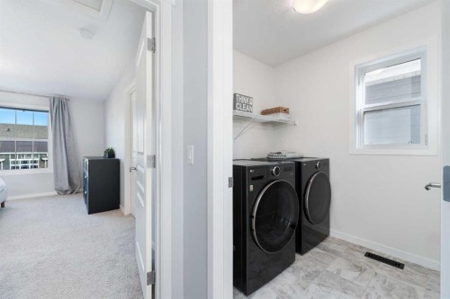 108 Masters Heights Se, Calgary, AB - Indoor Photo Showing Laundry Room