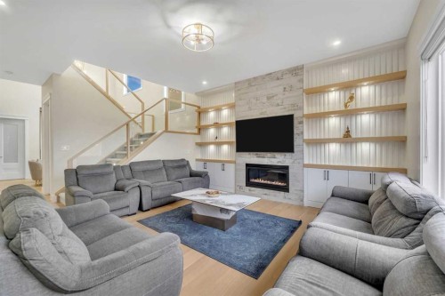 2012 Waterbury Road, Chestermere, AB - Indoor Photo Showing Living Room With Fireplace