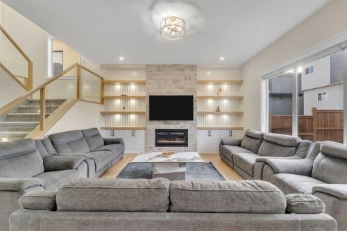 2012 Waterbury Road, Chestermere, AB - Indoor Photo Showing Living Room With Fireplace