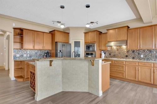 100 Cougarstone Manor Sw, Calgary, AB - Indoor Photo Showing Kitchen With Upgraded Kitchen