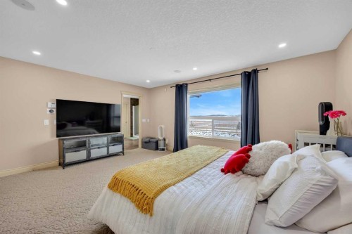 100 Cougarstone Manor Sw, Calgary, AB - Indoor Photo Showing Bedroom