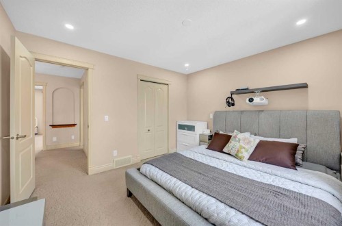 100 Cougarstone Manor Sw, Calgary, AB - Indoor Photo Showing Bedroom