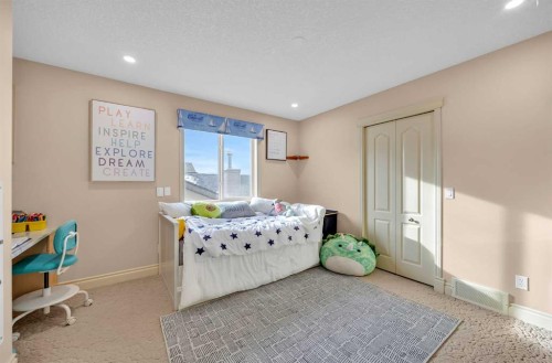 100 Cougarstone Manor Sw, Calgary, AB - Indoor Photo Showing Bedroom