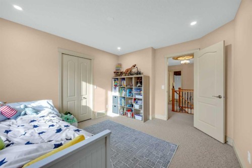 100 Cougarstone Manor Sw, Calgary, AB - Indoor Photo Showing Bedroom