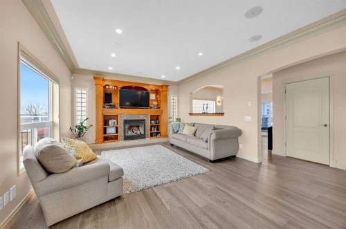 100 Cougarstone Manor Sw, Calgary, AB - Indoor Photo Showing Living Room With Fireplace