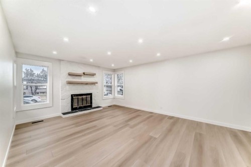 1242 Mardale Drive Ne, Calgary, AB - Indoor With Fireplace