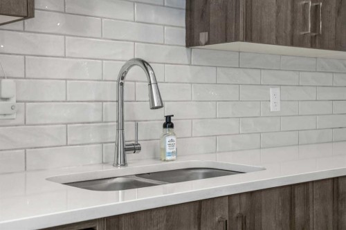 210-660 Shawnee Square Sw, Calgary, AB - Indoor Photo Showing Kitchen With Double Sink With Upgraded Kitchen