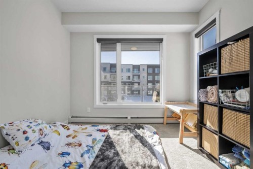 210-660 Shawnee Square Sw, Calgary, AB - Indoor Photo Showing Bedroom