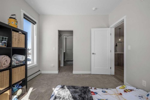 210-660 Shawnee Square Sw, Calgary, AB - Indoor Photo Showing Bedroom
