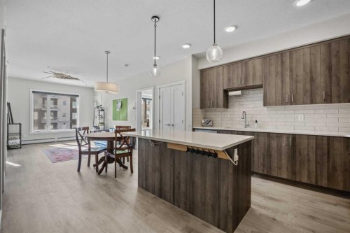 210-660 Shawnee Square Sw, Calgary, AB - Indoor Photo Showing Kitchen With Upgraded Kitchen