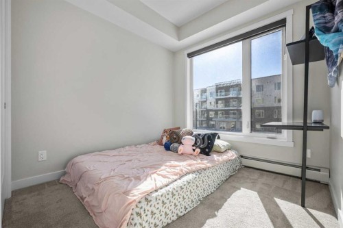 210-660 Shawnee Square Sw, Calgary, AB - Indoor Photo Showing Bedroom