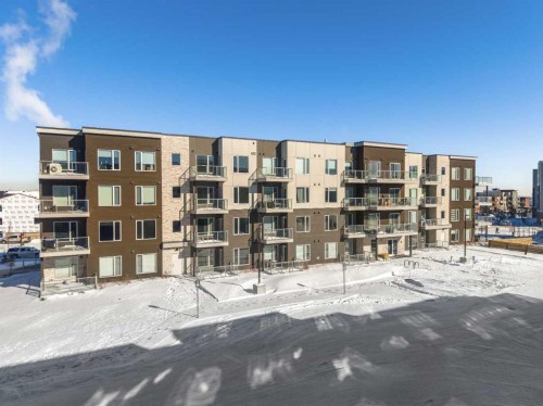 210-660 Shawnee Square Sw, Calgary, AB - Outdoor With Balcony With Facade