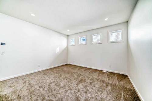 10 Rodelle Common Nw, Calgary, AB - Indoor Photo Showing Other Room