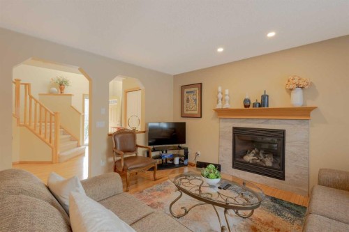 20 Tuscany Ridge Crescent Nw, Calgary, AB - Indoor Photo Showing Living Room With Fireplace
