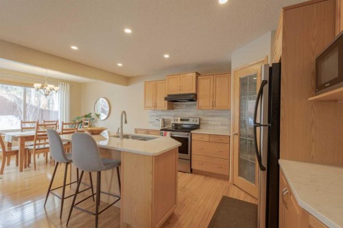 20 Tuscany Ridge Crescent Nw, Calgary, AB - Indoor Photo Showing Kitchen With Stainless Steel Kitchen With Double Sink