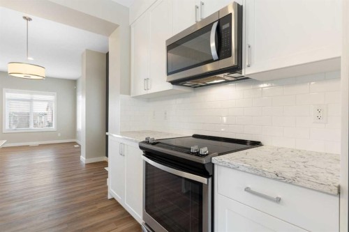 217 Sage Bluff Drive Nw, Calgary, AB - Indoor Photo Showing Kitchen With Upgraded Kitchen