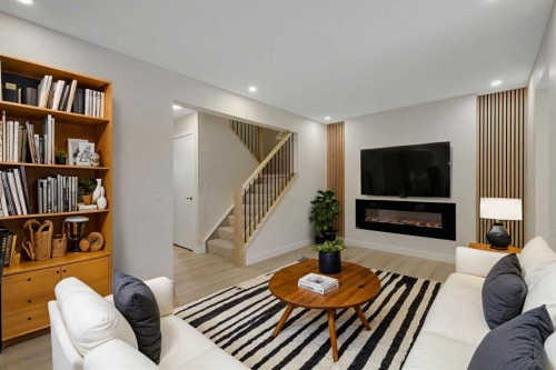 13 Penworth Close Se, Calgary, AB - Indoor Photo Showing Living Room With Fireplace
