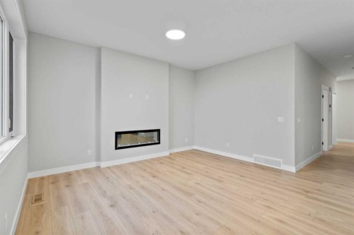 151 Belvedere Crescent Se, Calgary, AB - Indoor With Fireplace