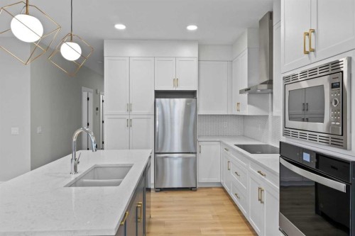 151 Belvedere Crescent Se, Calgary, AB - Indoor Photo Showing Kitchen With Double Sink With Upgraded Kitchen