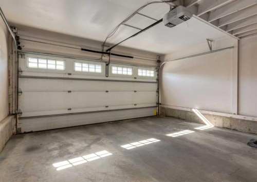 24 Silverado Saddle Court Sw, Calgary, AB - Indoor Photo Showing Garage