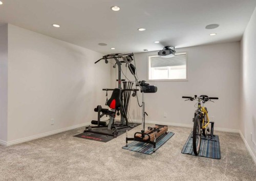 24 Silverado Saddle Court Sw, Calgary, AB - Indoor Photo Showing Gym Room
