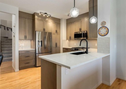 24 Silverado Saddle Court Sw, Calgary, AB - Indoor Photo Showing Kitchen With Upgraded Kitchen