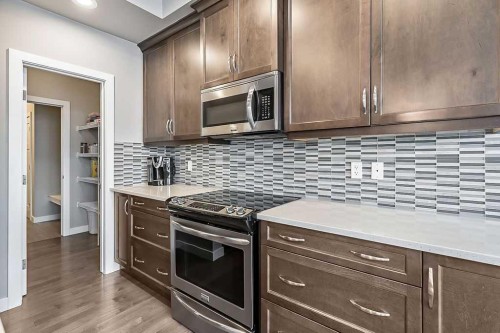 94 Cimarron Springs Circle, Okotoks, AB - Indoor Photo Showing Kitchen With Upgraded Kitchen