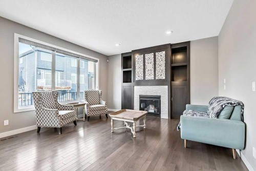 94 Cimarron Springs Circle, Okotoks, AB - Indoor Photo Showing Living Room With Fireplace