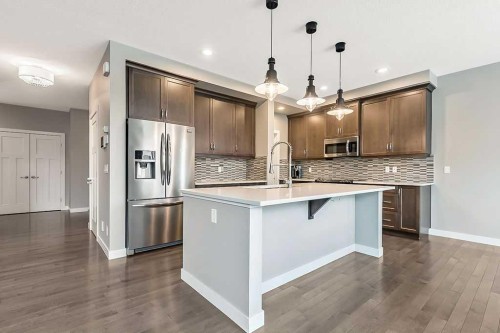 94 Cimarron Springs Circle, Okotoks, AB - Indoor Photo Showing Kitchen With Upgraded Kitchen