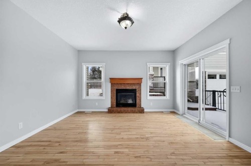 107 Strathmore Lakes Common, Strathmore, AB - Indoor Photo Showing Living Room With Fireplace