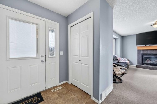 107 Strathmore Lakes Common, Strathmore, AB - Indoor Photo Showing Other Room With Fireplace