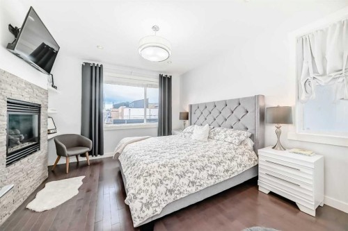 2807 25 Street Sw, Calgary, AB - Indoor Photo Showing Bedroom With Fireplace
