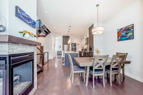 2807 25 Street Sw, Calgary, AB - Indoor Photo Showing Dining Room With Fireplace