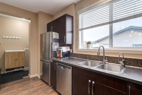 152 New Brighton Grove Se, Calgary, AB - Indoor Photo Showing Kitchen With Double Sink